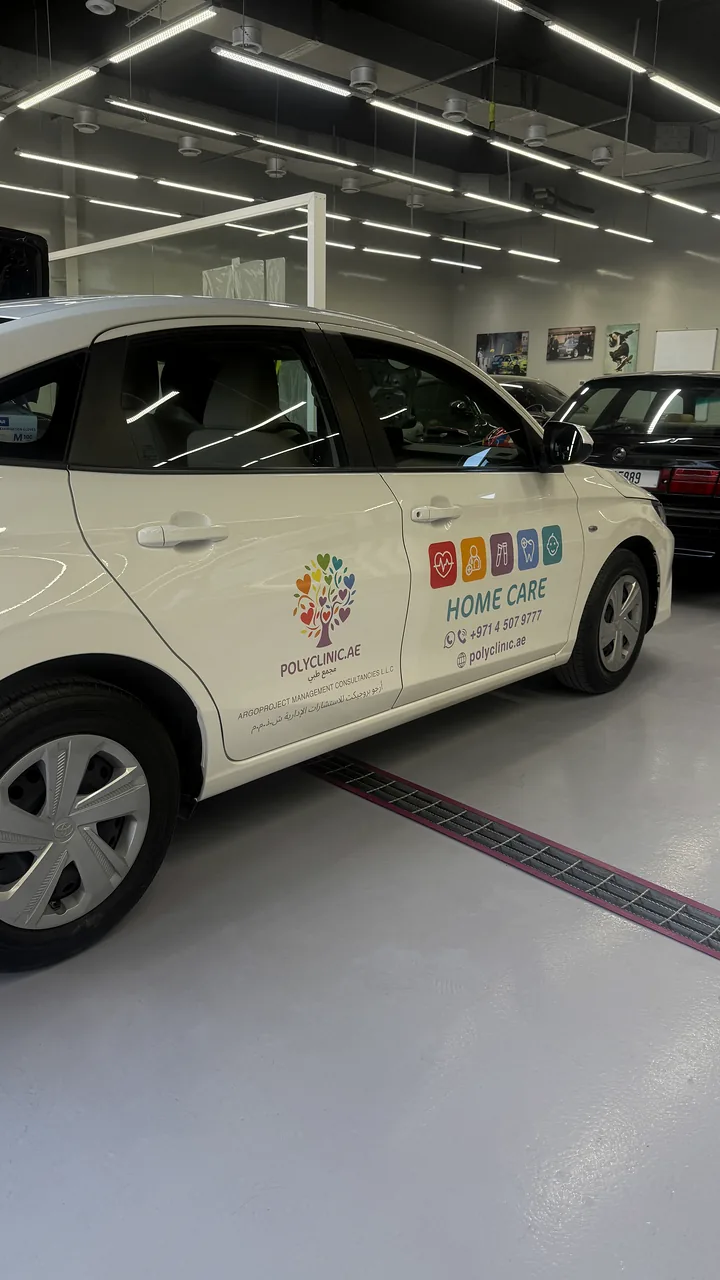 White Home Care SUV with restrained door logos and contact graphics